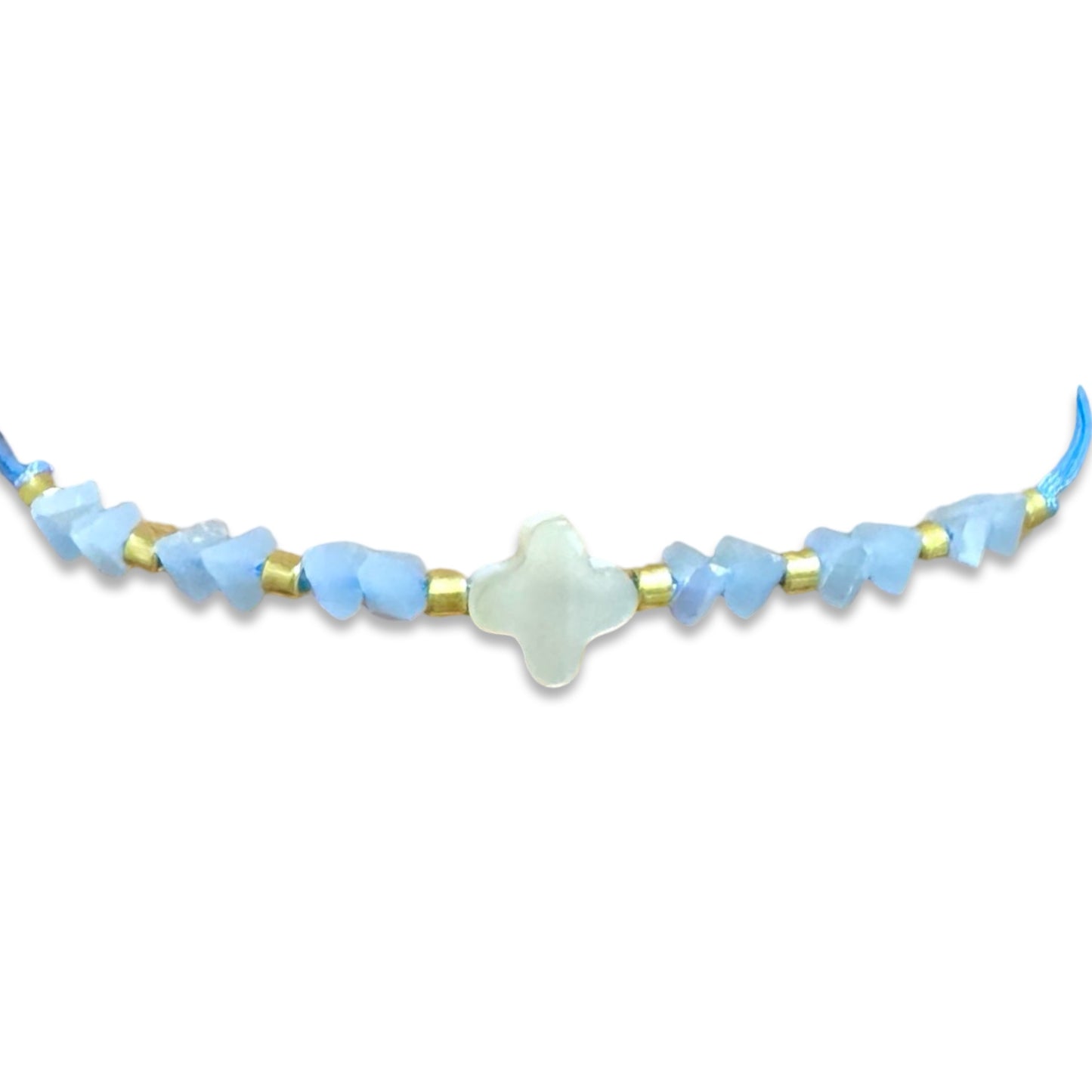 String Bracelet of Assorted Colors with Mother of Pearl Cross